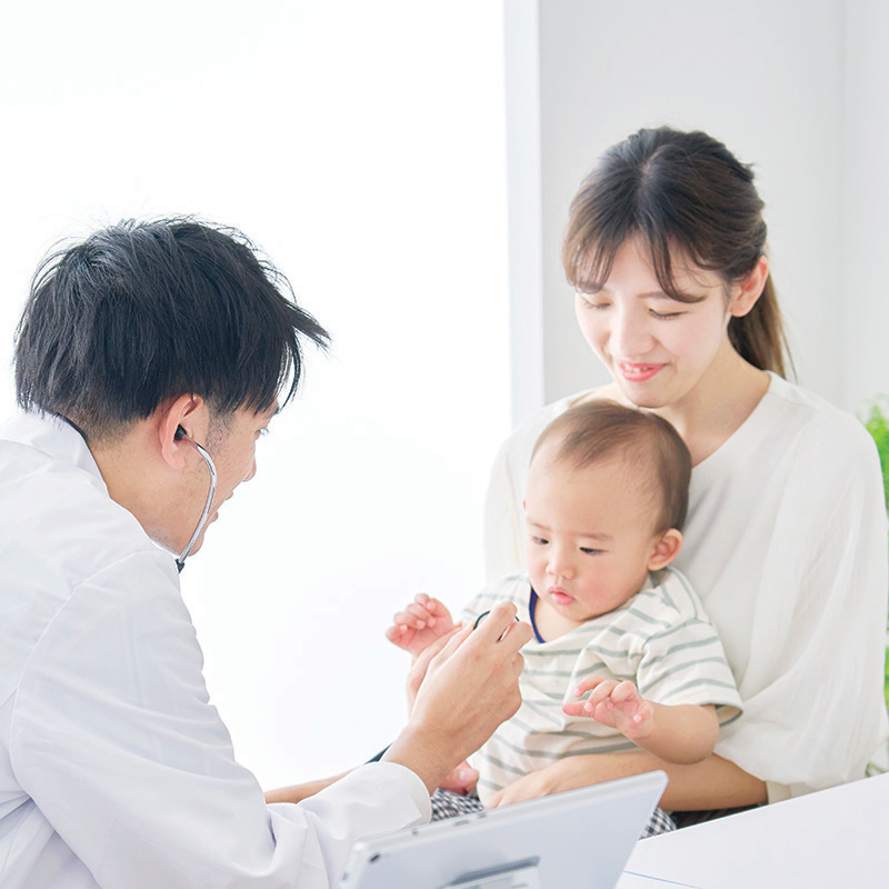 Pediatrician with child